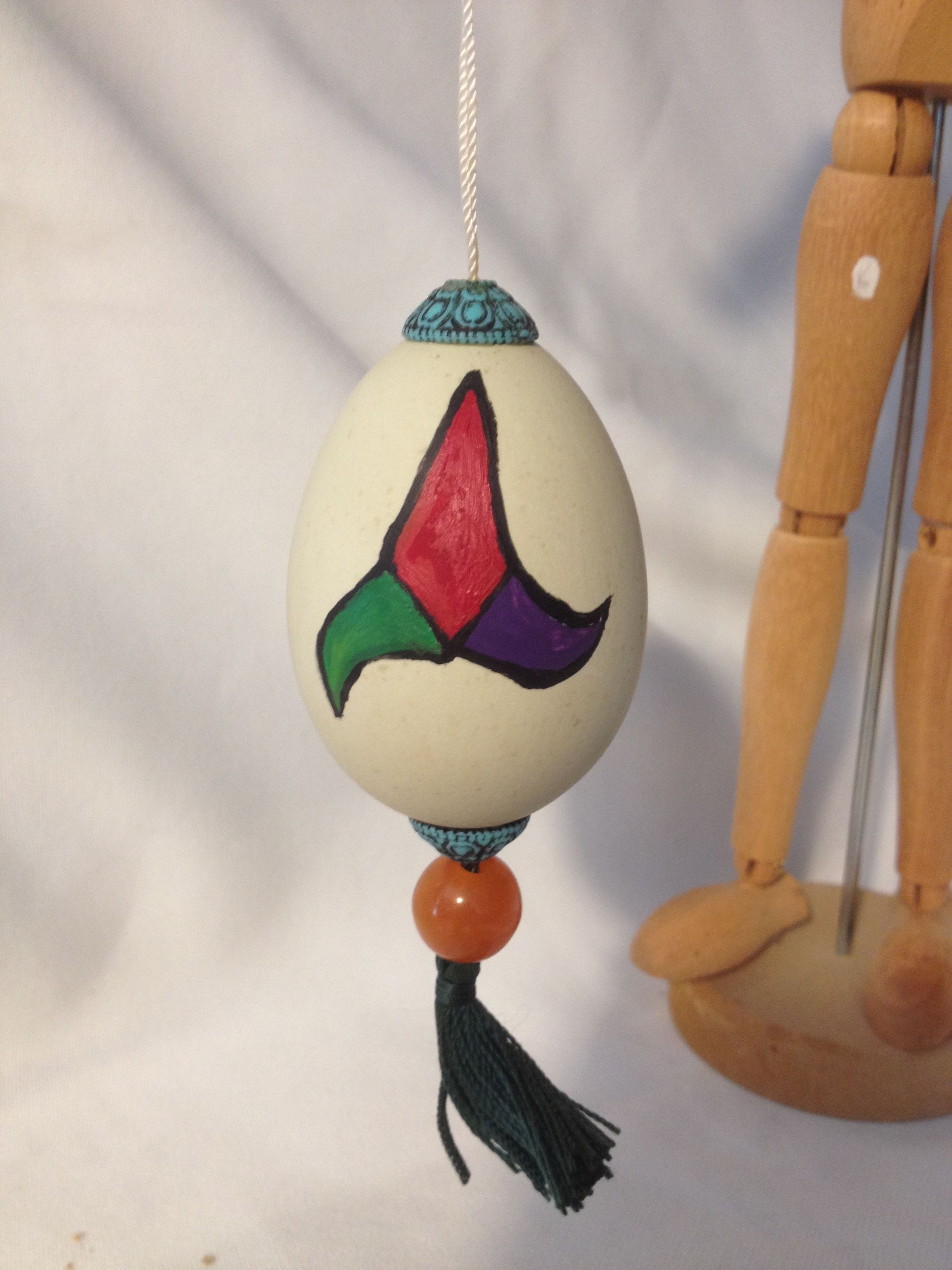 Painted chickens egg with tri-shield $20.