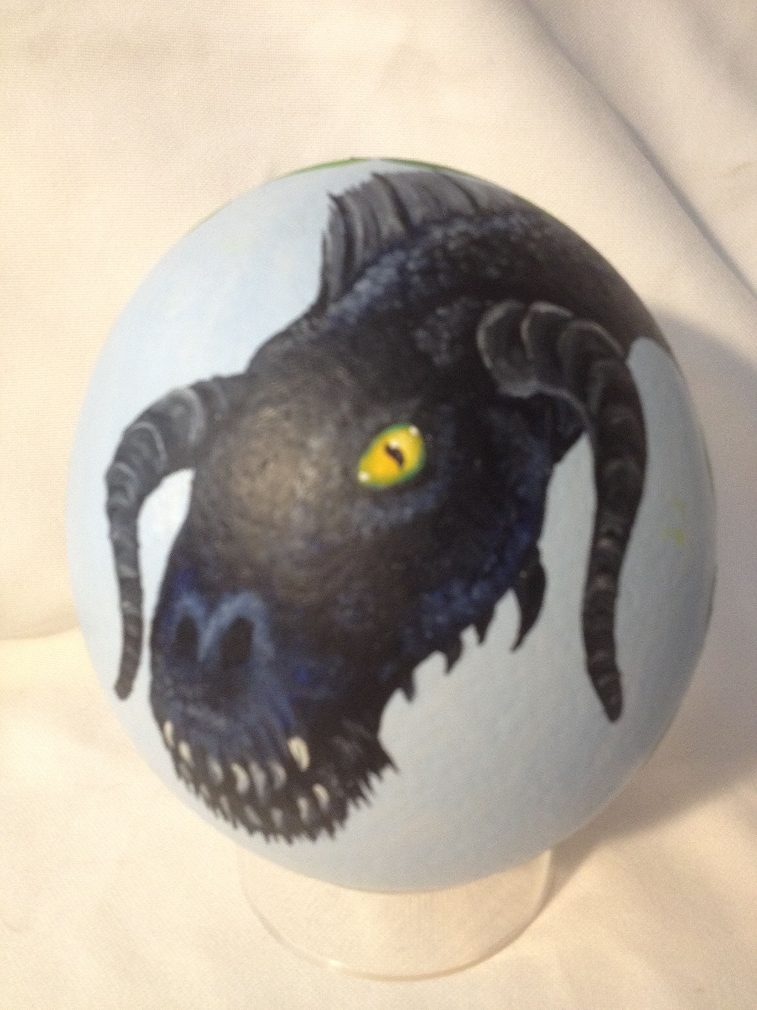 Oil panted Ostrich egg with Black Dragon face$80.
