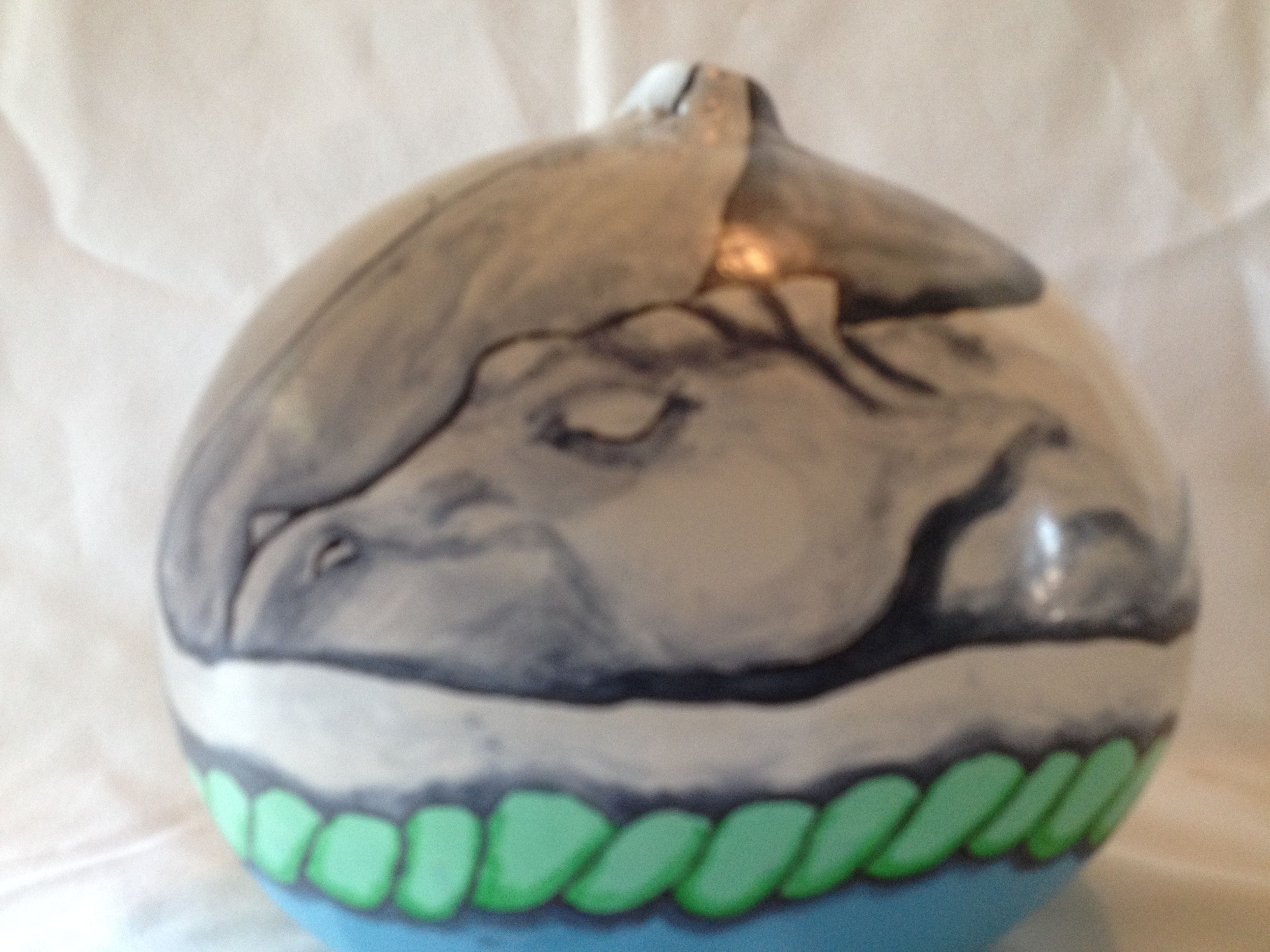 White dragon curled up sleeping in basket. $30.