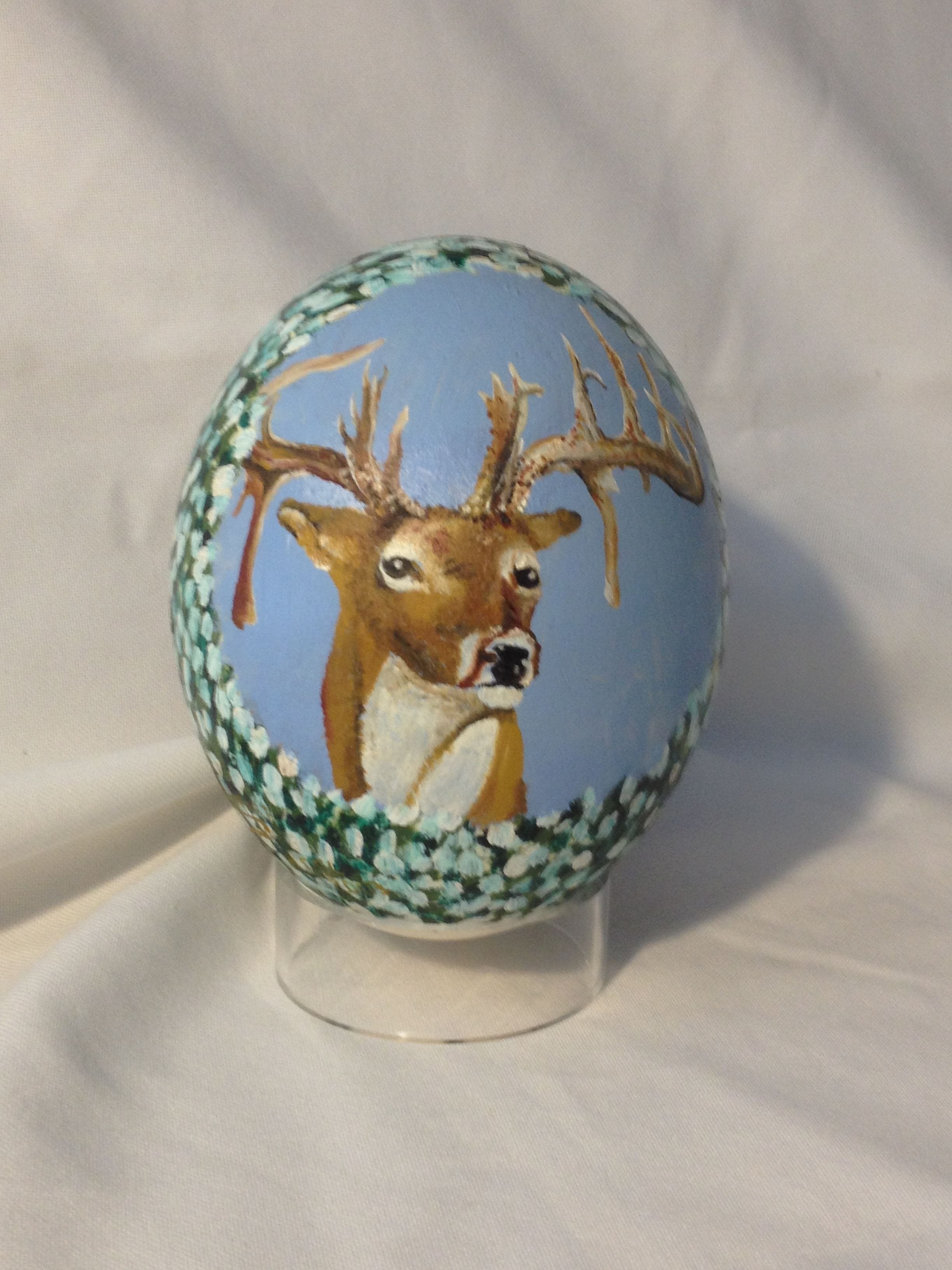 Oil paint on Ostrich egg of Hole in the horn buck $80.
