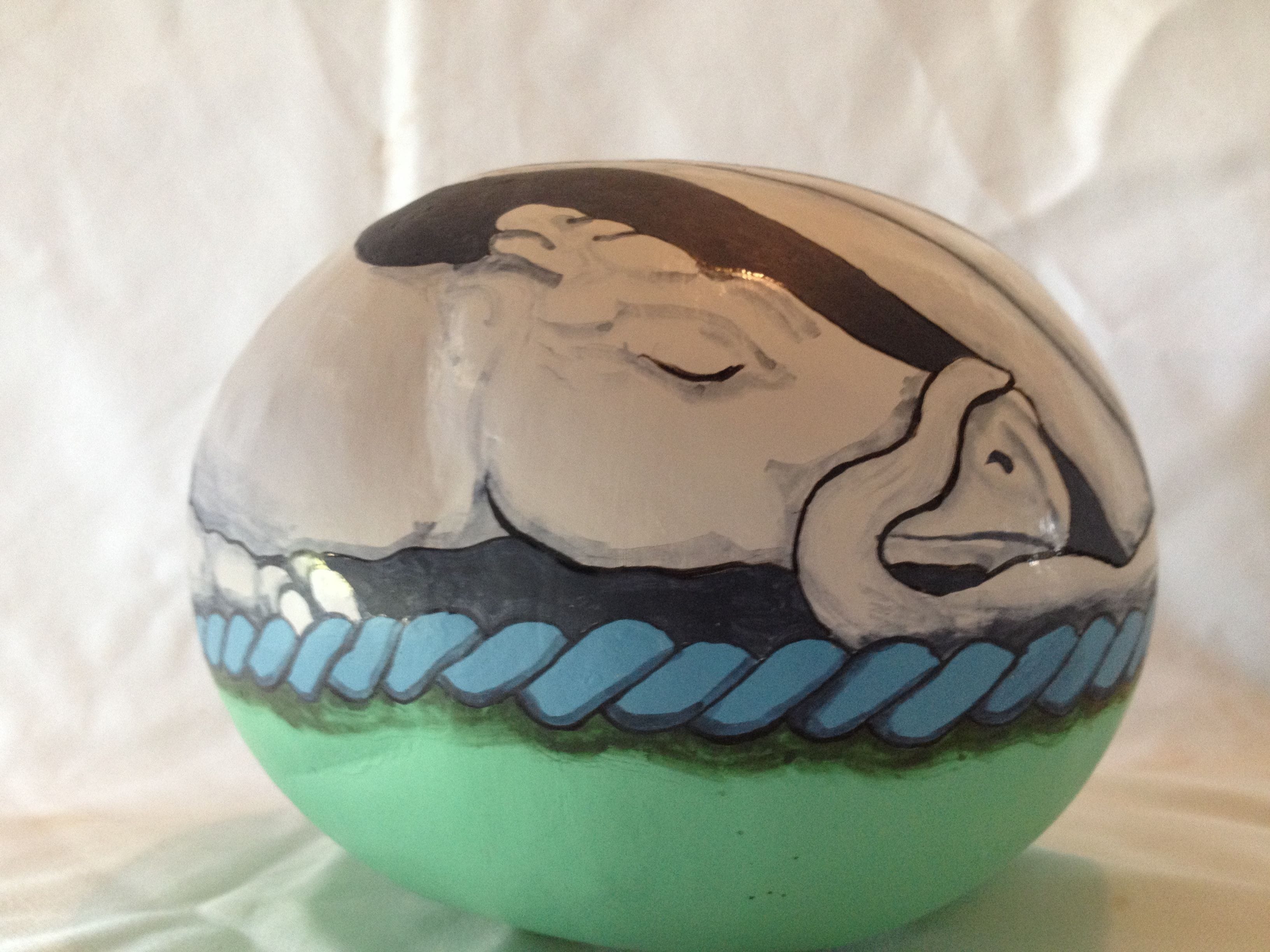 Sleeping white dragon in basket. $25.