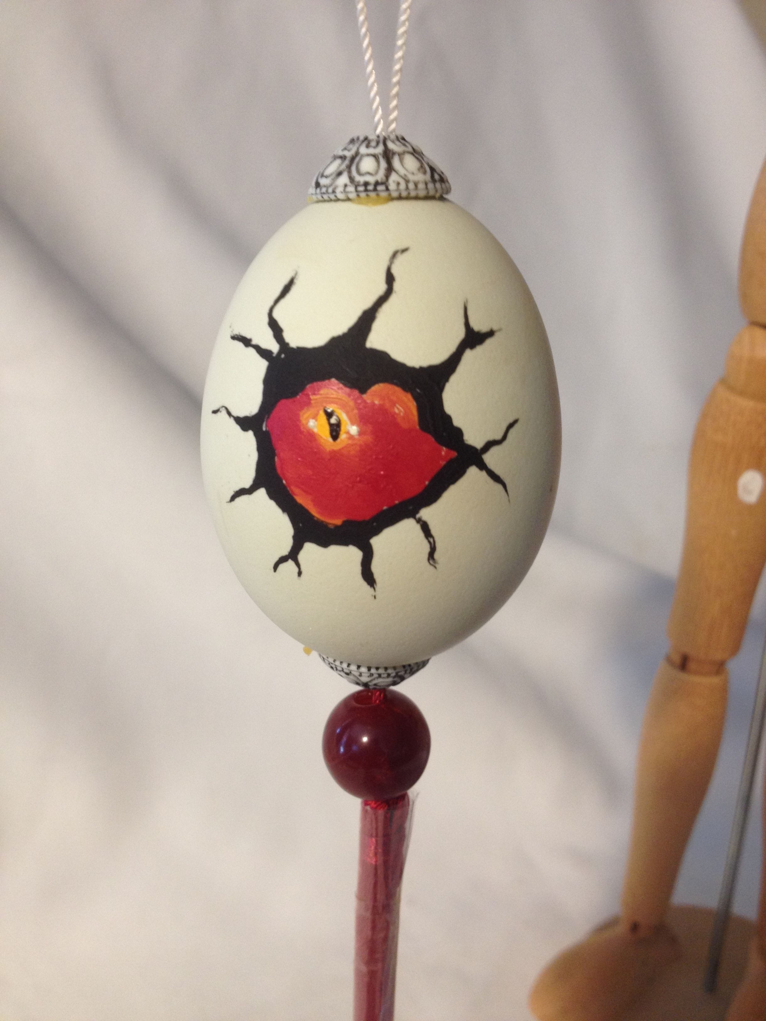 Painted chicken egg with Red Dragonett's face$20.